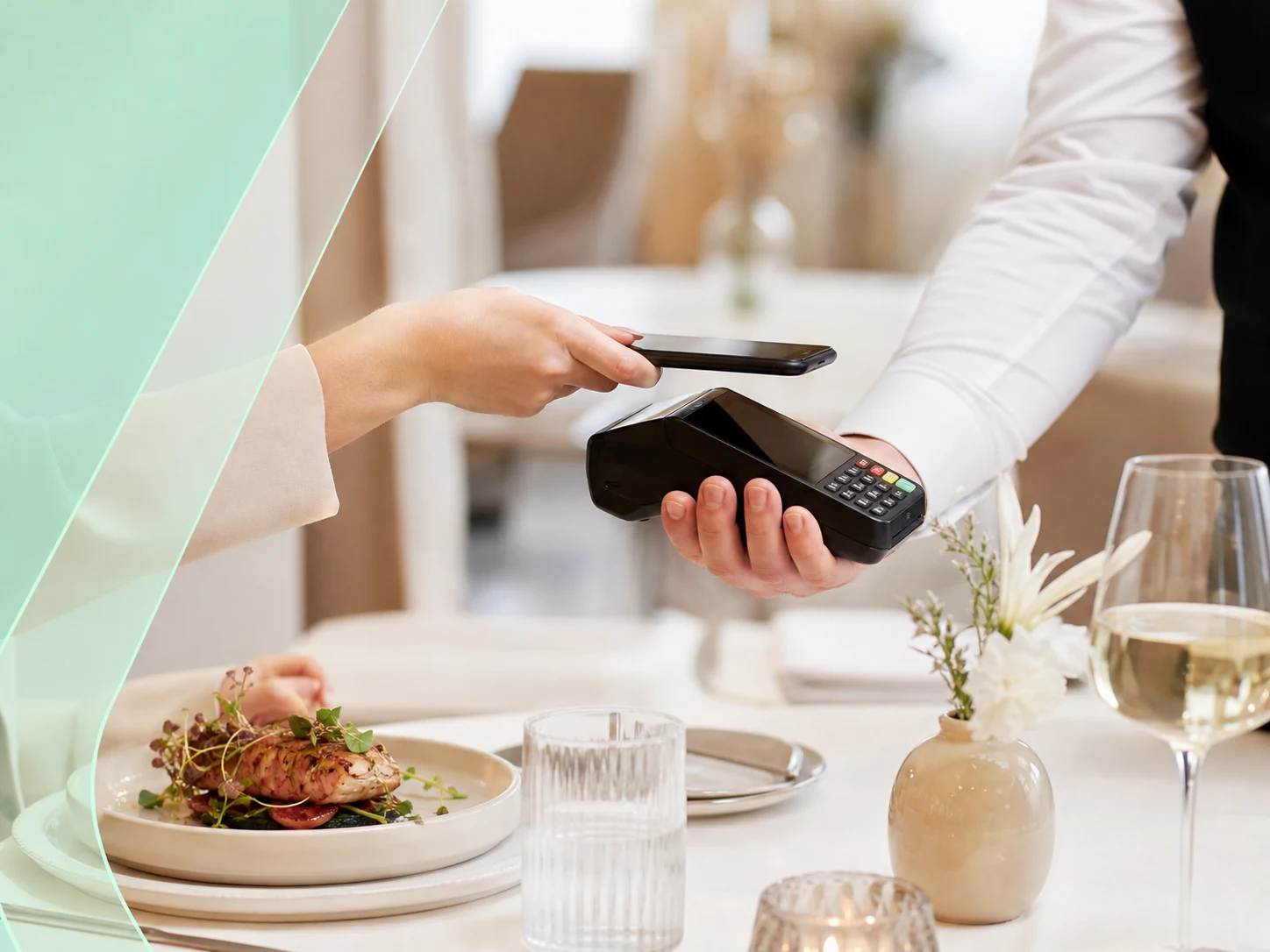 Fine dining table service payment with handheld terminal and plated food